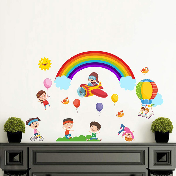 kids play with rainbow balloon in open sky wall sticker